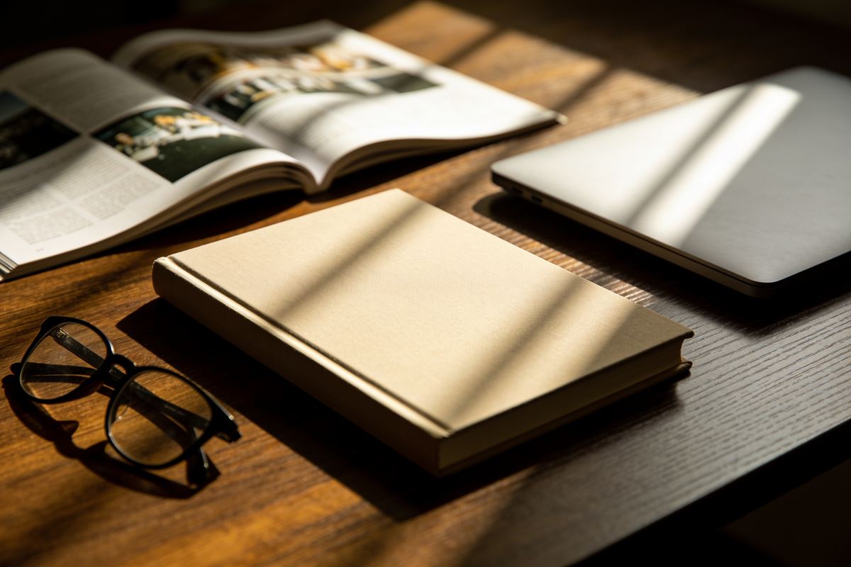 A published book and magazine on a desk